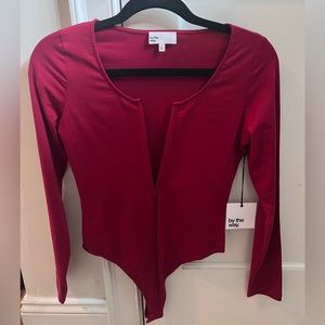 by the way. Women’s burgundy/red V neck low cut bodysuit. Size S. Long sleeve